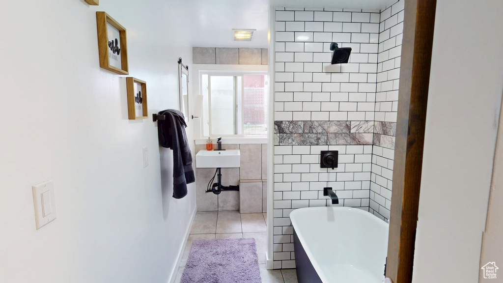 Bathroom with tile patterned flooring and tile walls