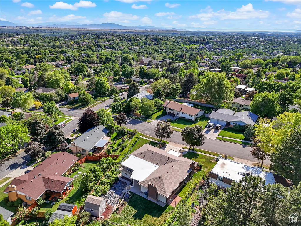 Aerial view of residential area featuring a mountain backdrop