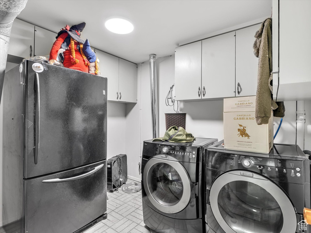 Laundry room with washer and clothes dryer