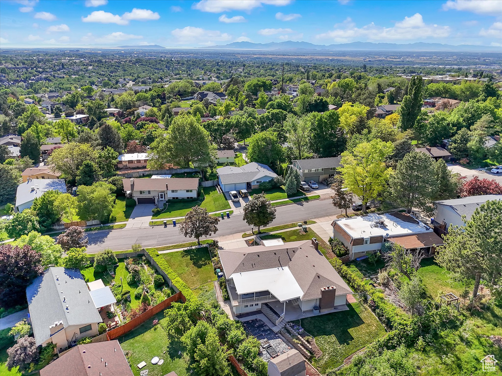 Aerial perspective of suburban area featuring a mountain backdrop