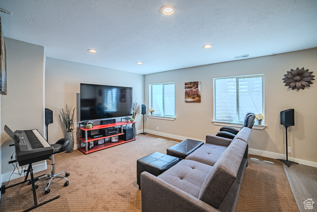 Living room featuring recessed lighting and baseboards