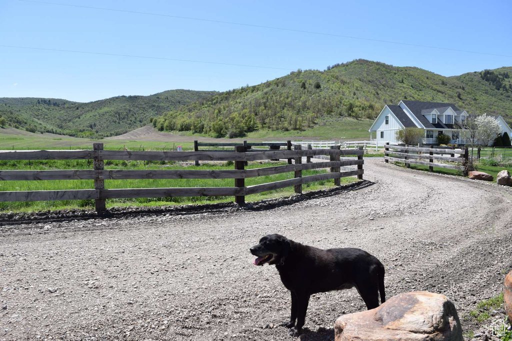 View of mountain backdrop featuring rural landscape and a pastoral area