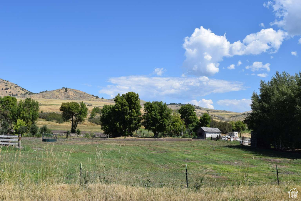 View of yard featuring a view of countryside and a mountain view