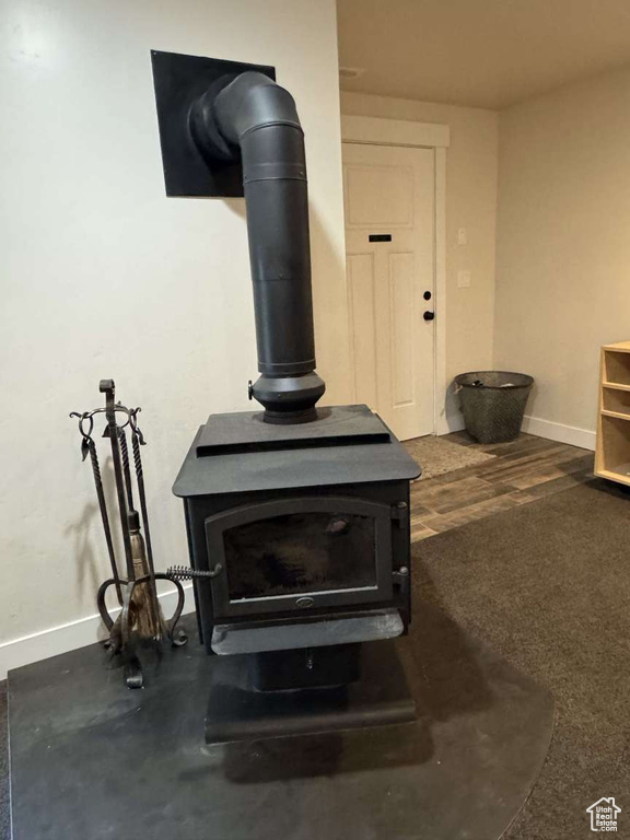 Detailed view of a wood stove and baseboards