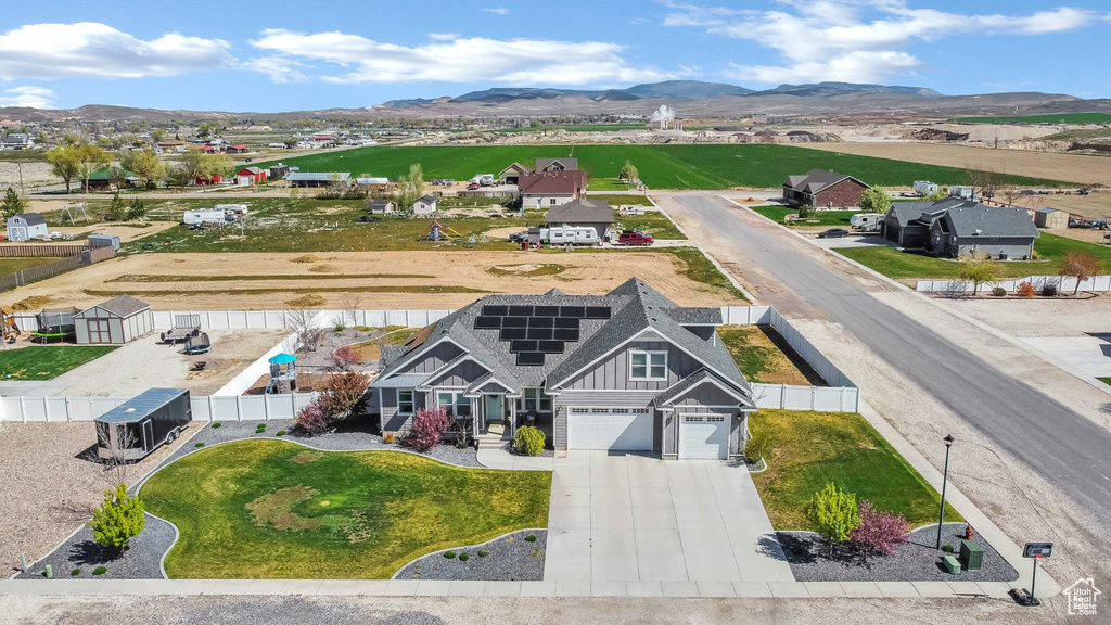 Aerial view of residential area featuring a mountain backdrop