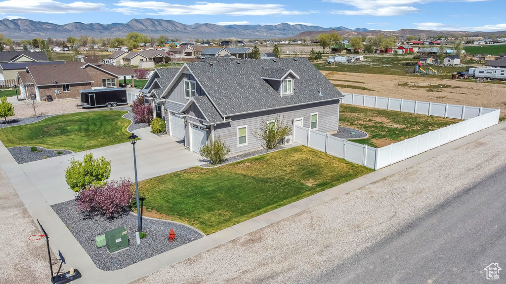 Aerial perspective of suburban area with a mountainous background