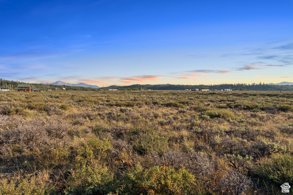 Property view of mountains with a rural view