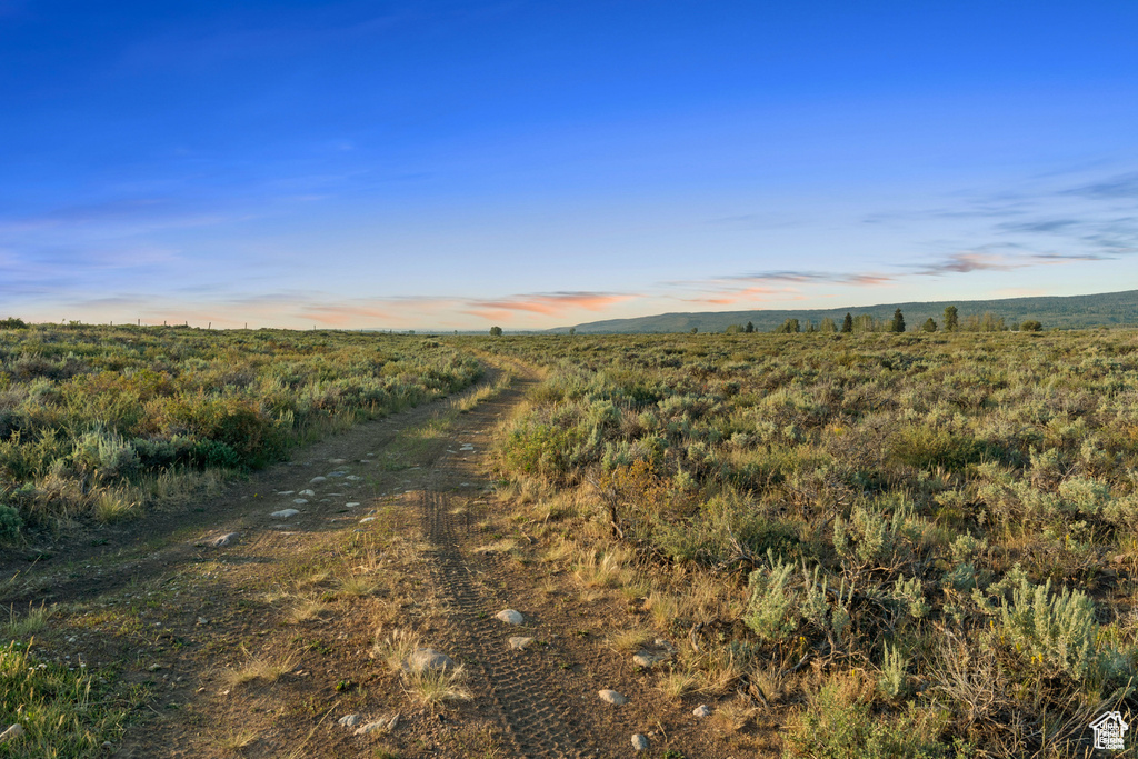 Nature at dusk featuring a rural view