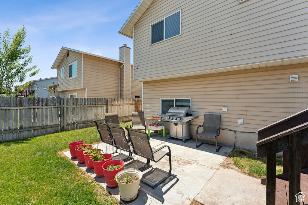 View of patio featuring area for grilling