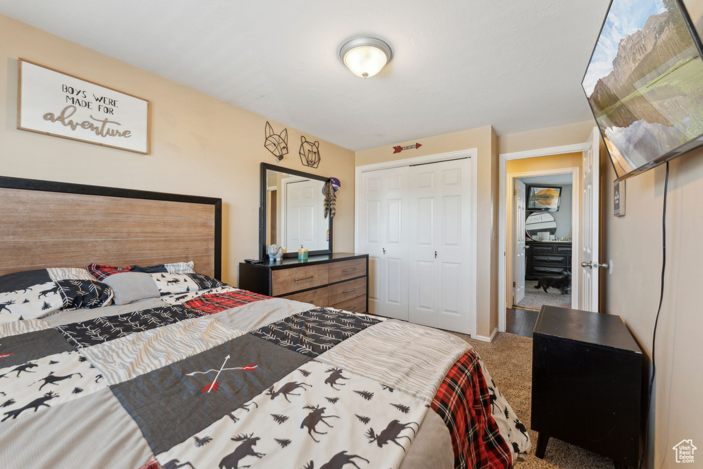 Carpeted bedroom featuring baseboards