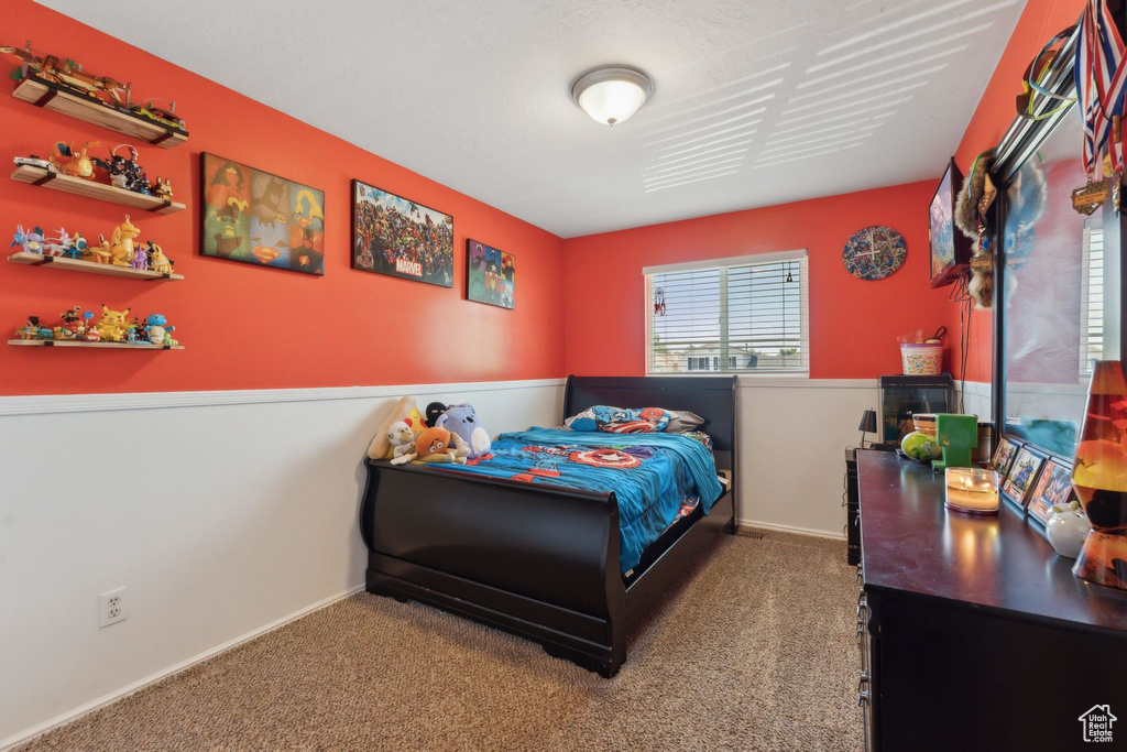 Carpeted bedroom with baseboards