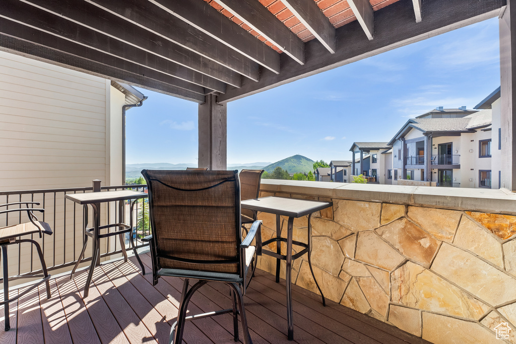 Wooden terrace featuring a residential view