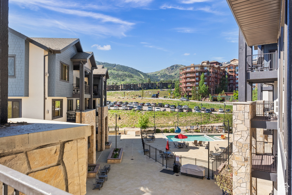 View of patio / terrace with a mountain view and a community pool