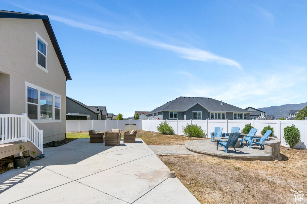 Fenced backyard with a patio area and an outdoor hangout area