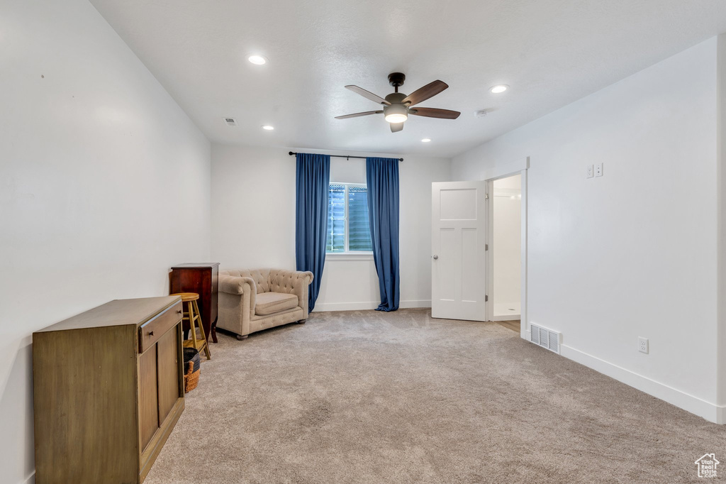 Unfurnished room featuring ceiling fan, light carpet, recessed lighting, and baseboards