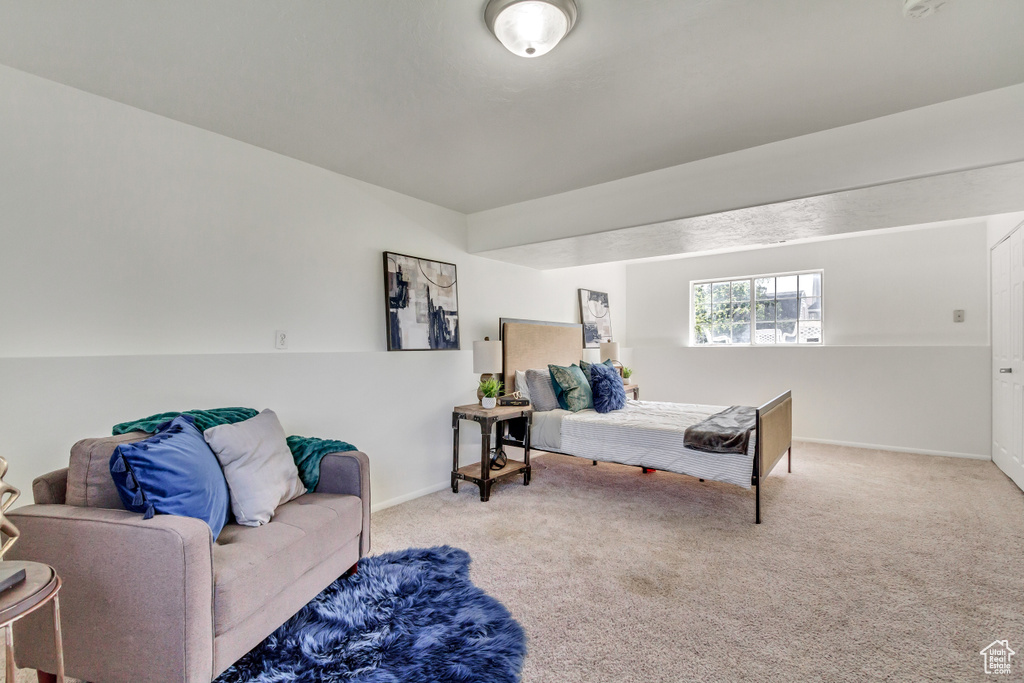 Carpeted bedroom with baseboards