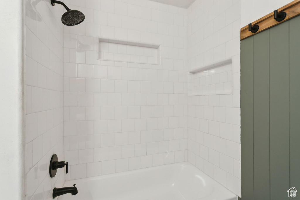 Bathroom with shower / washtub combination
