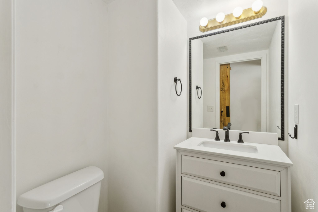 Half bath with toilet and vanity