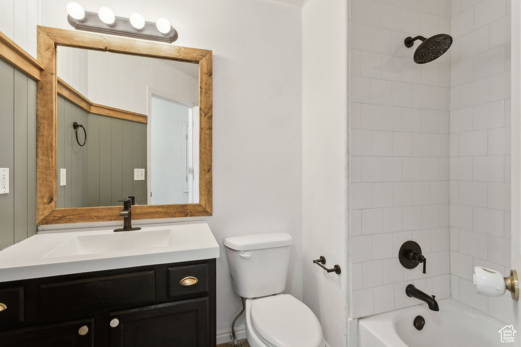 Full bath with toilet, vanity, and bathtub / shower combination
