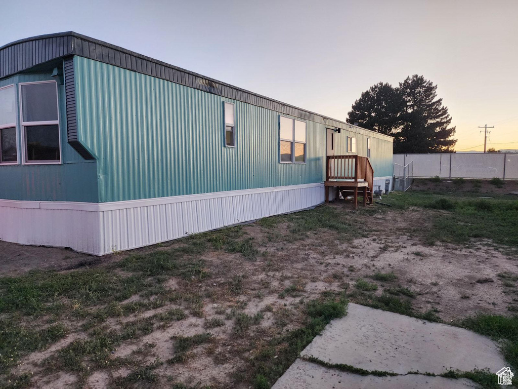 View of property exterior at dusk