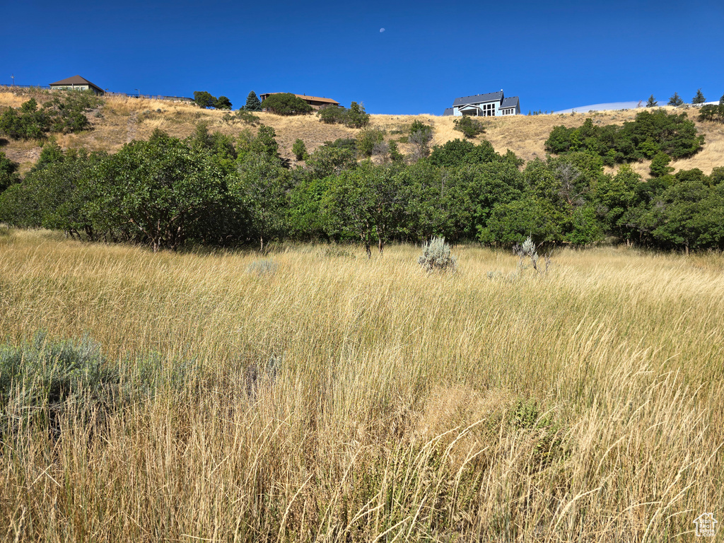 View of mountain backdrop with rural landscape
