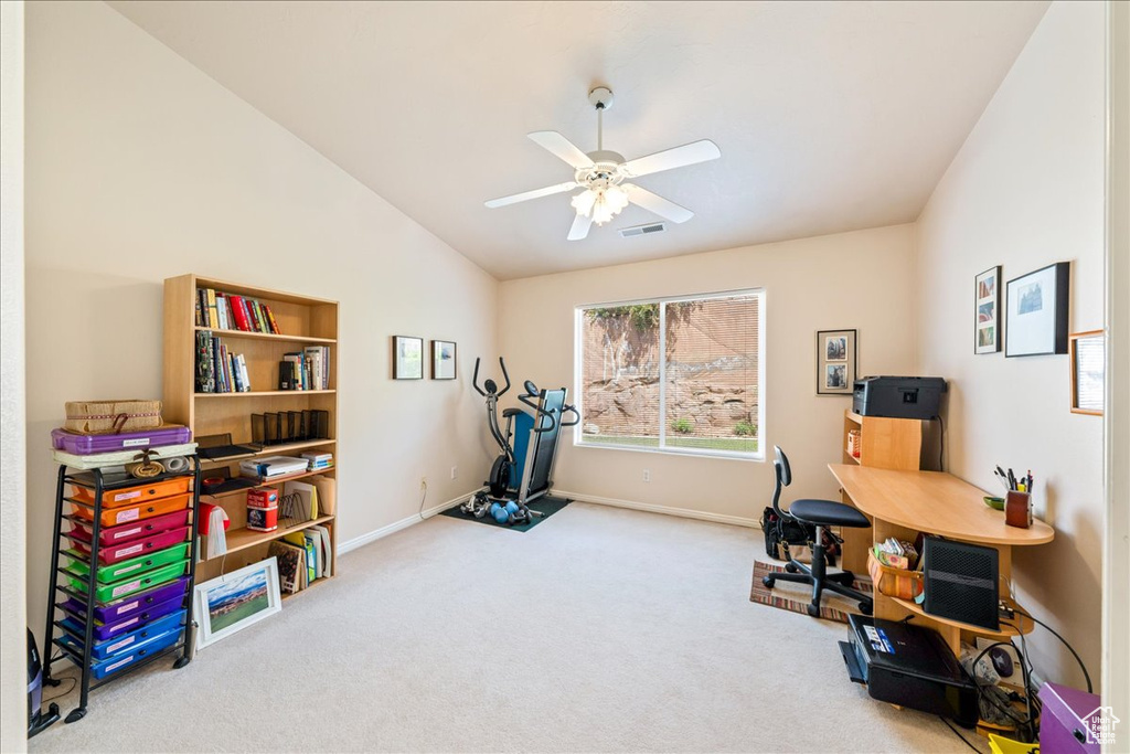Office area featuring carpet flooring, lofted ceiling, baseboards, and a ceiling fan