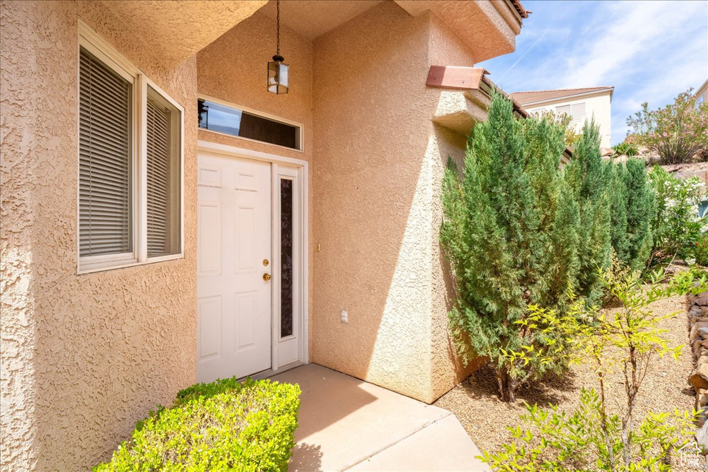Doorway to property with stucco siding