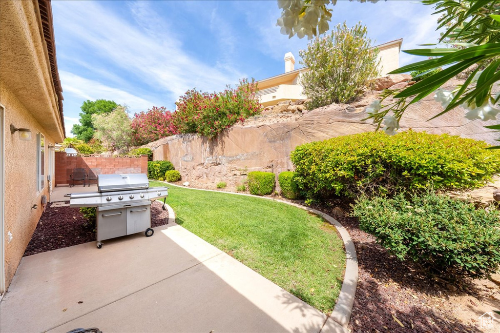 Fenced backyard featuring a patio