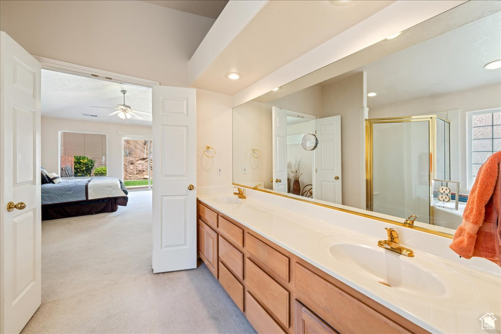 Full bath with a stall shower, double vanity, recessed lighting, ceiling fan, and connected bathroom