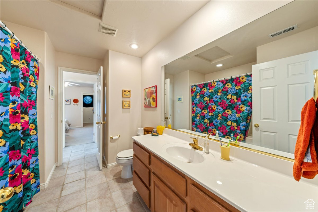 Full bath with vanity, toilet, tile patterned floors, recessed lighting, and a shower with curtain