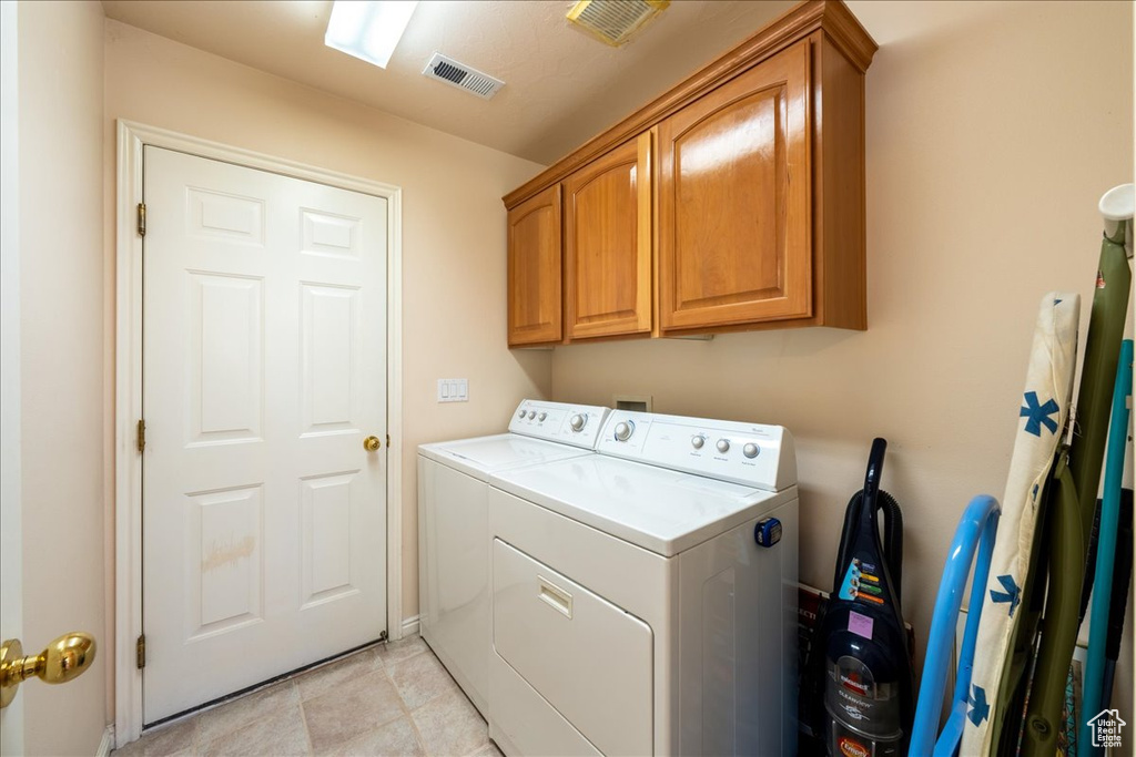 Laundry room with washer and dryer and cabinet space