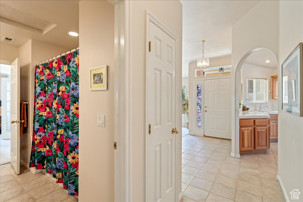 Bathroom with tile patterned flooring, vanity, recessed lighting, and a shower with shower curtain