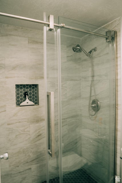Full bathroom with a shower stall