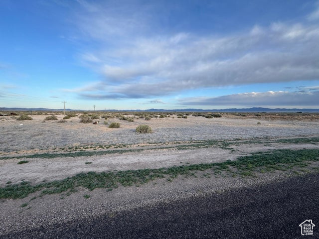 View of yard with a rural view