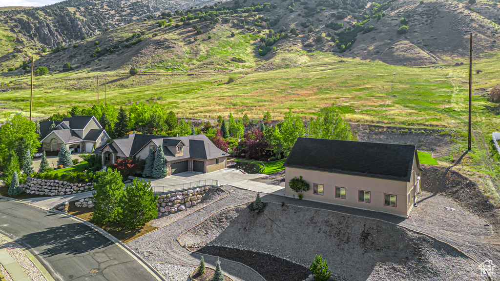 View from above of property with a mountain backdrop