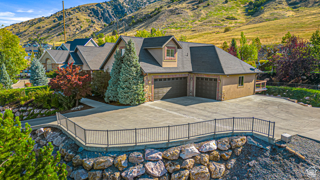 View of subject property with mountains