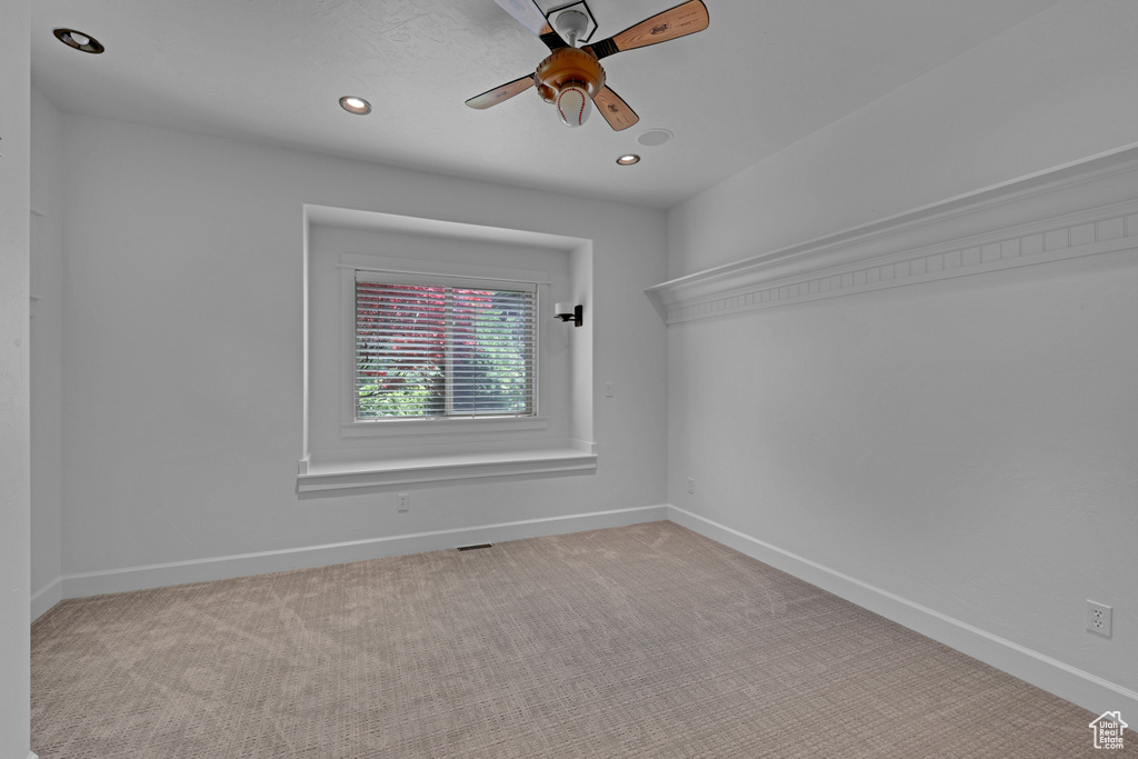 Unfurnished room featuring baseboards, light colored carpet, a ceiling fan, and recessed lighting