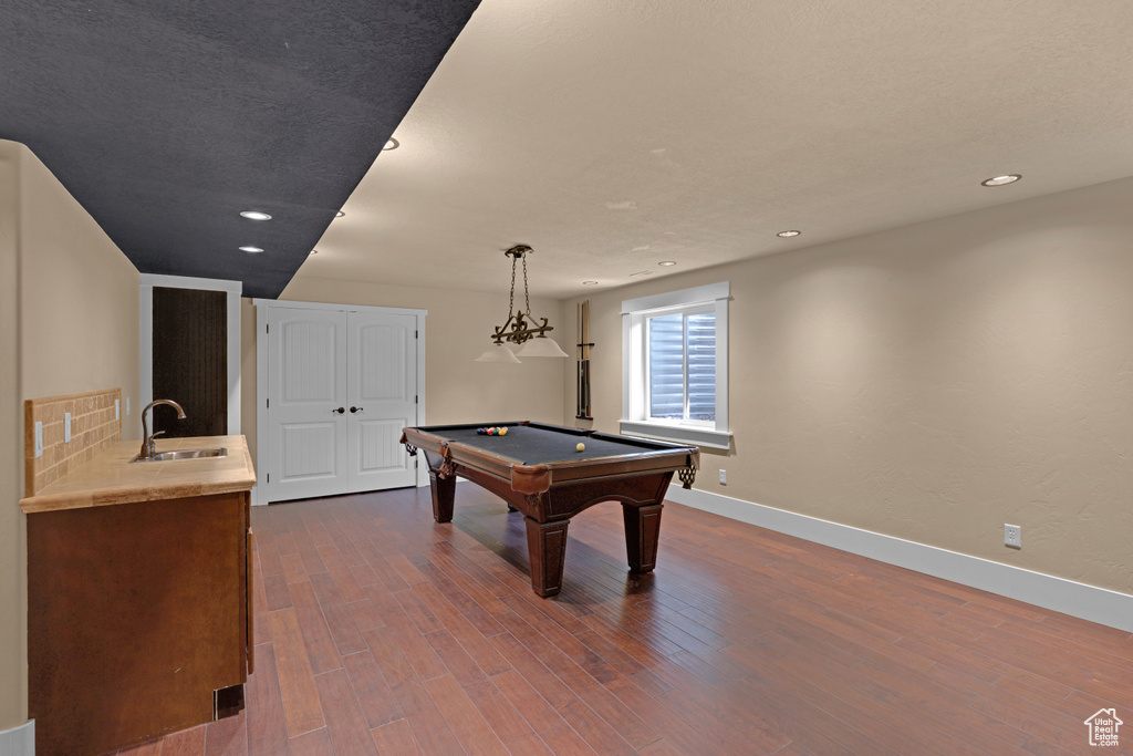 Rec room with a sink, pool table, baseboards, dark wood-style flooring, and recessed lighting