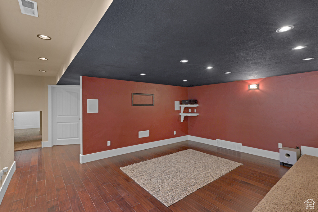 Cinema with baseboards, recessed lighting, and wood finished floors