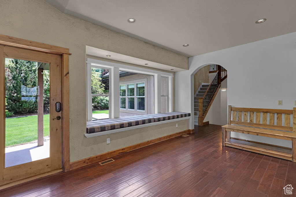 Foyer entrance featuring wood finished floors, stairway, recessed lighting, and baseboards