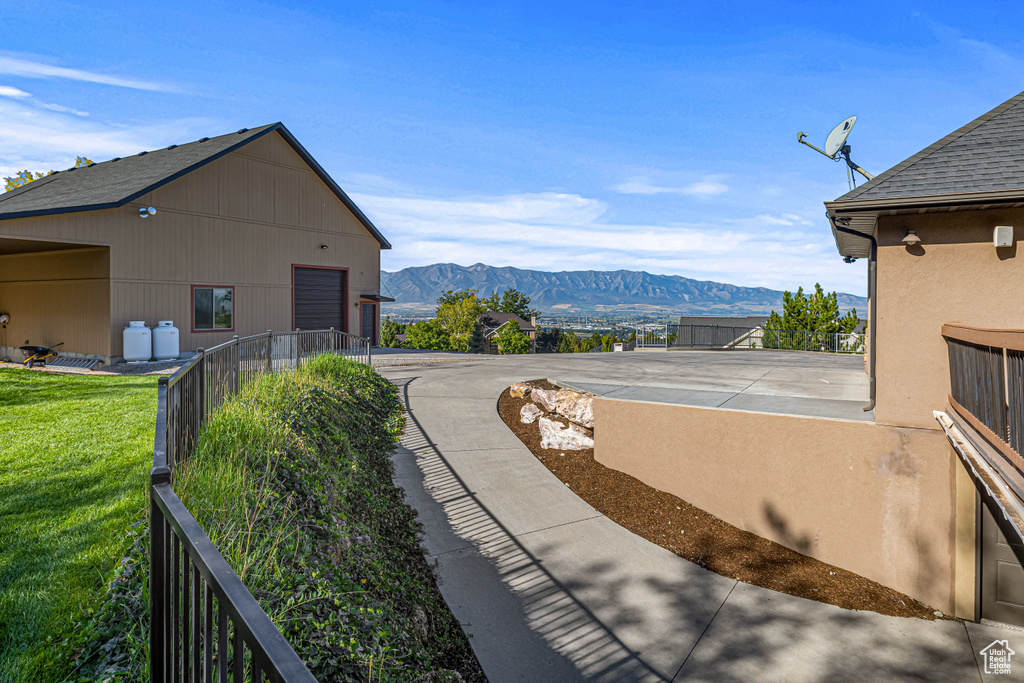 View of yard featuring a mountain view and driveway