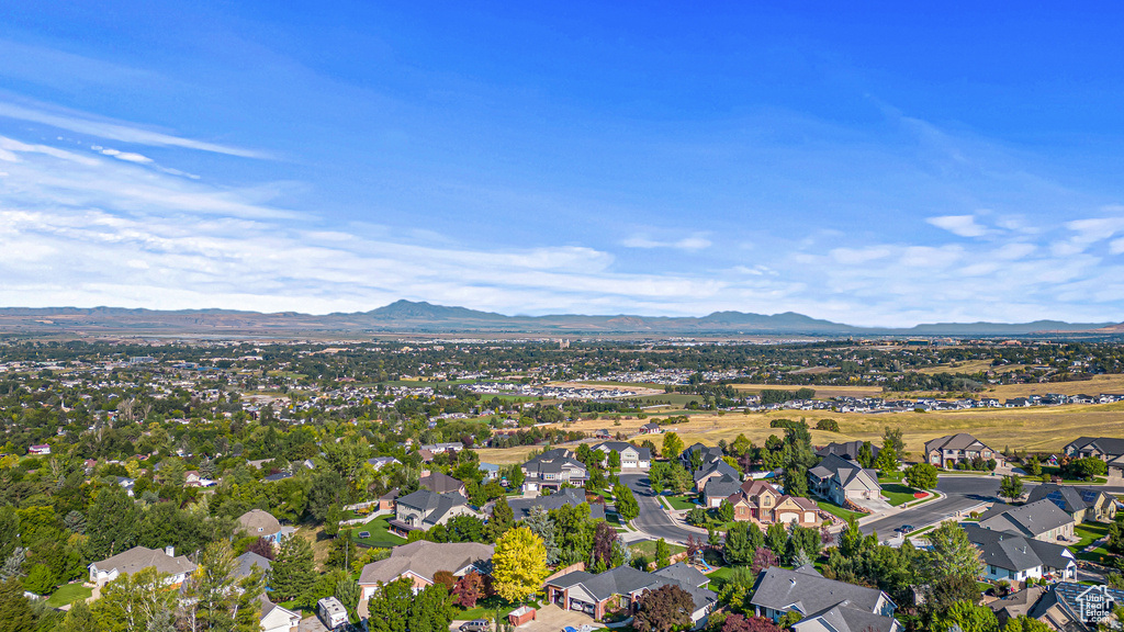 Aerial view of property\\\\\\\'s location featuring a mountain backdrop and nearby suburban area