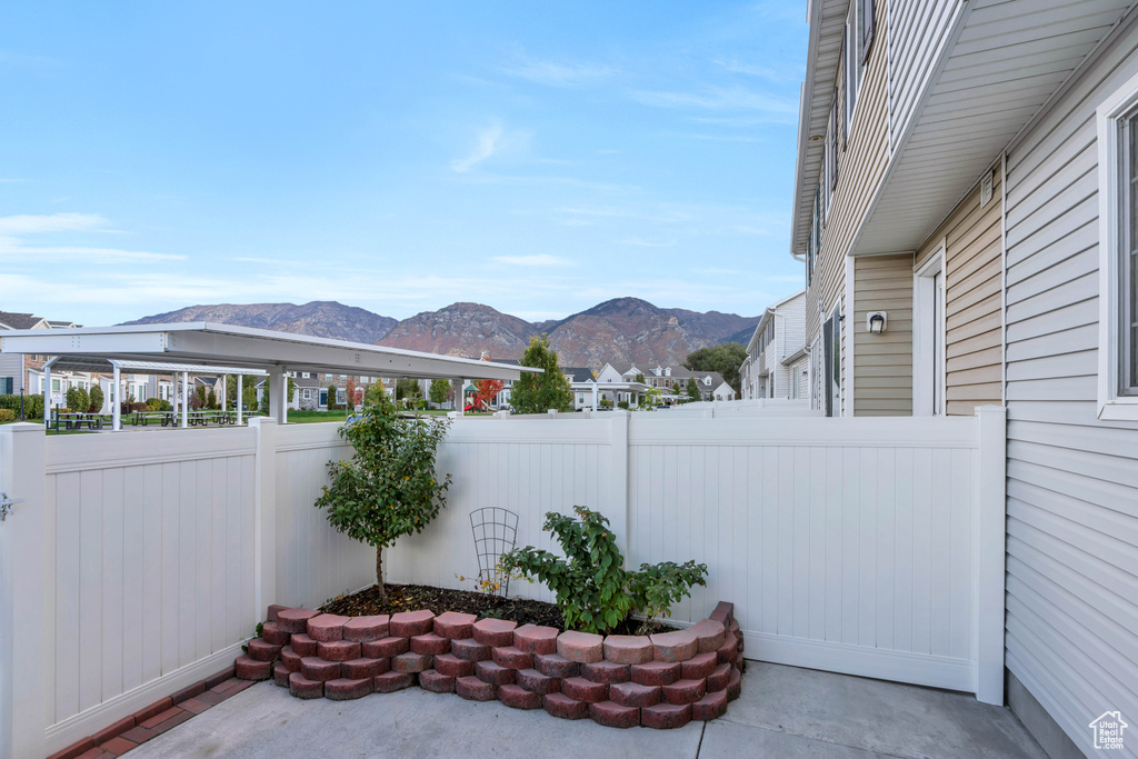Fenced backyard with a mountain view