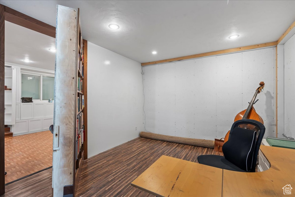 Workout room with recessed lighting and wood finished floors