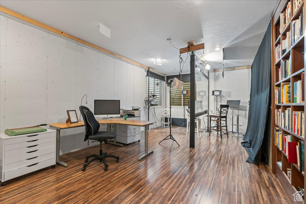 Office area with hardwood / wood-style flooring