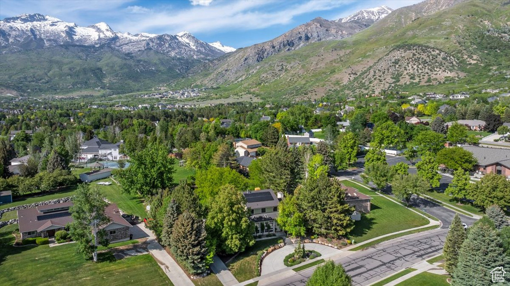 Aerial perspective of suburban area featuring a mountain backdrop