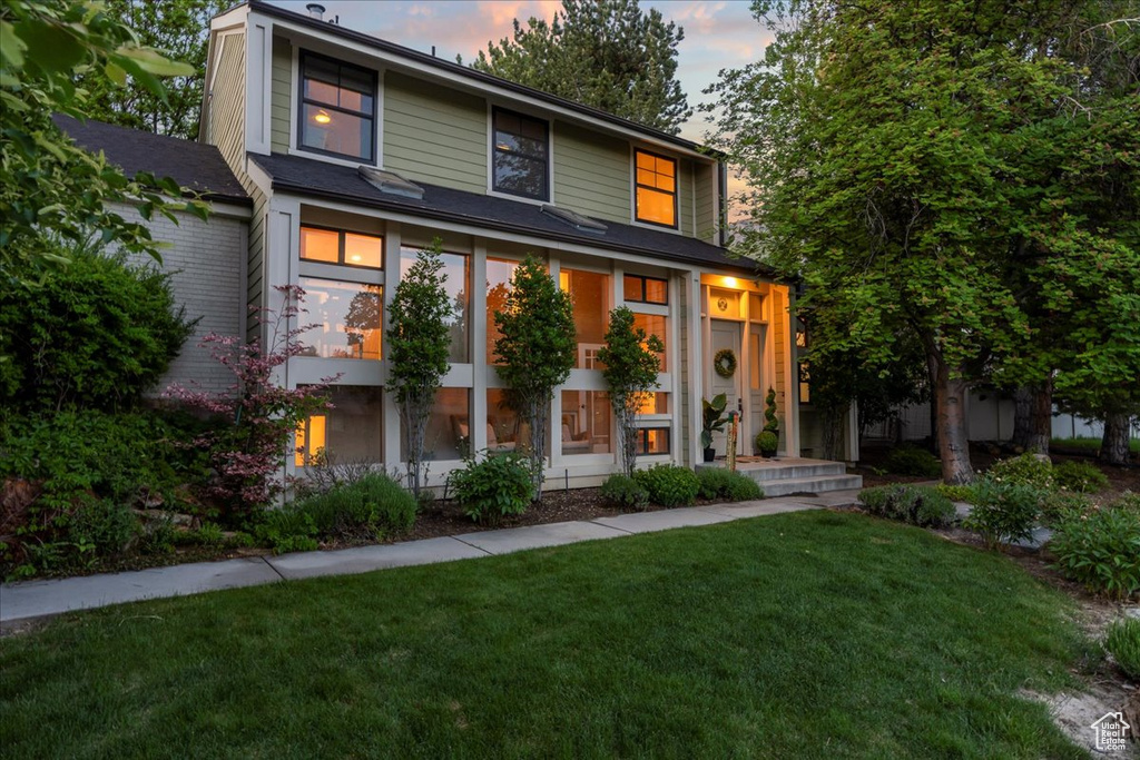 View of front of house with a yard