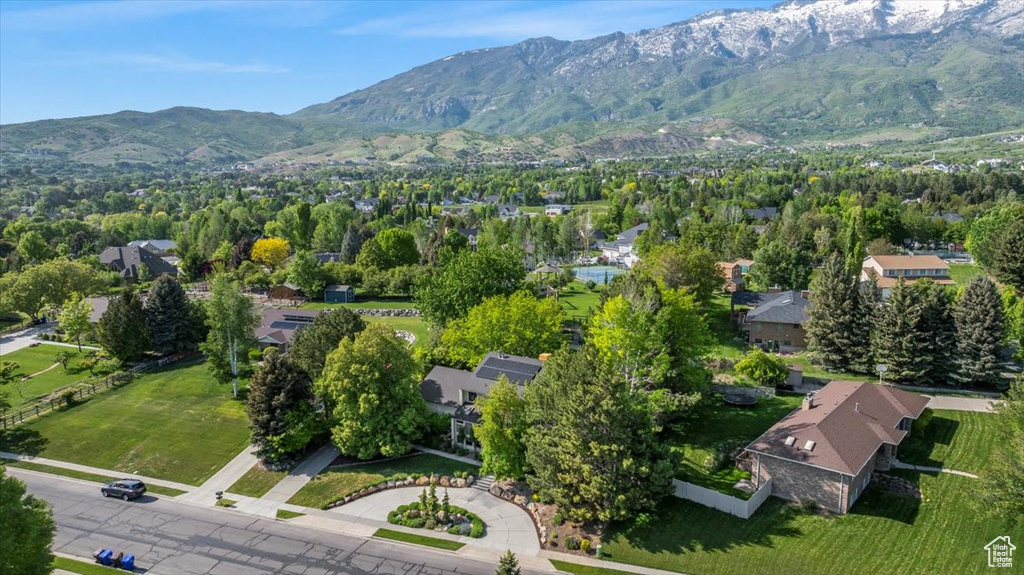 Aerial perspective of suburban area featuring a mountainous background