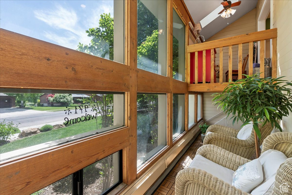 Sunroom / solarium with high vaulted ceiling