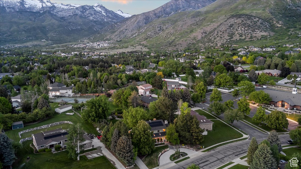 Aerial perspective of suburban area with a mountain backdrop